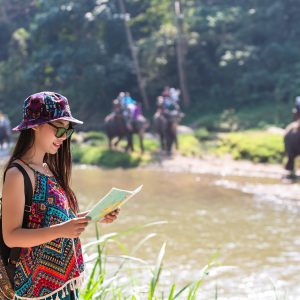 Female Tourists On Hand Have A Happy Travel Map.